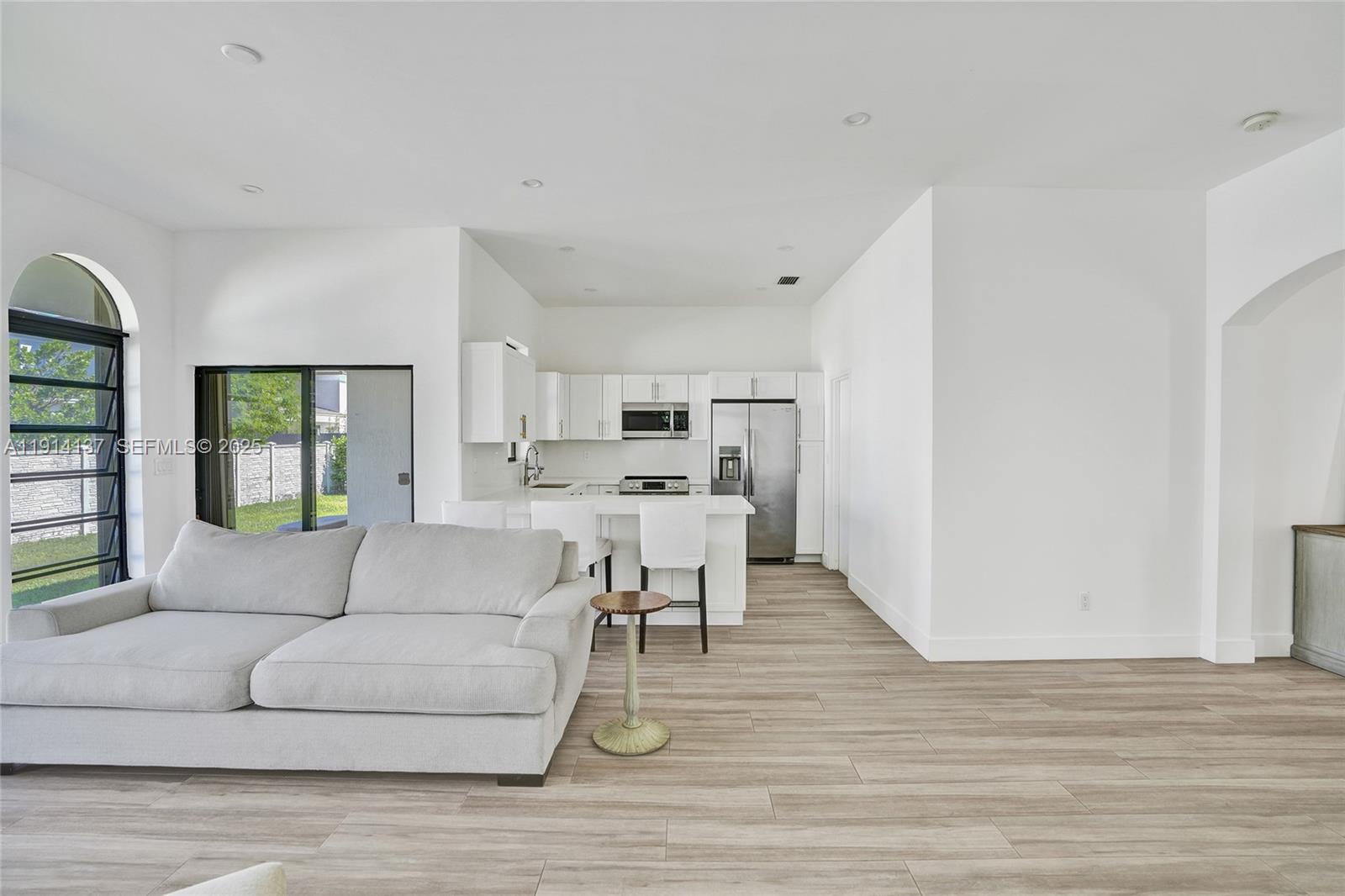 8371 Southwest 122nd Street Miami, FL 33156 - Photo 29 of 39 a living room with furniture and a wooden floor
