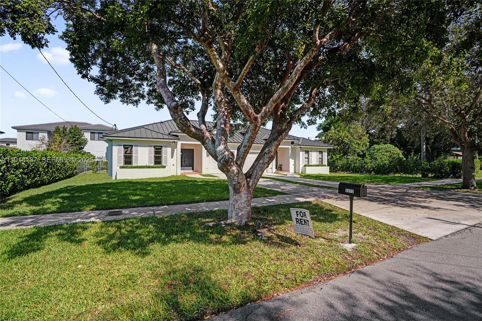 8371 Southwest 122nd Street Miami, FL 33156 - Photo 6 of 39 a view of a house with a yard