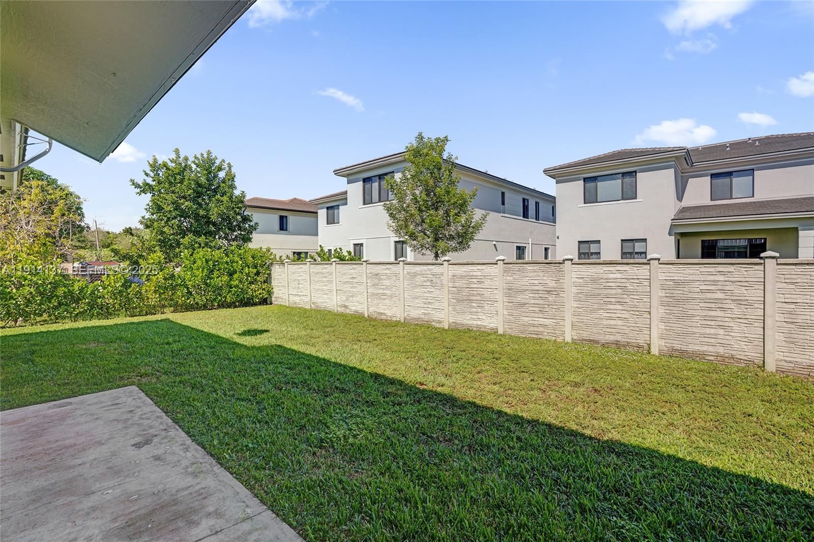 8371 Southwest 122nd Street Miami, FL 33156 - Photo 9 of 39 a view of a house with a yard