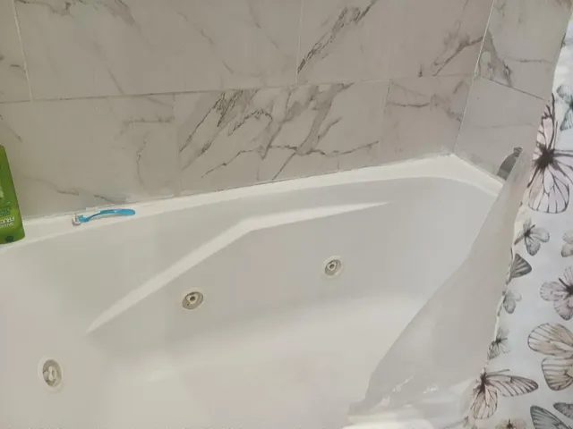 a bathroom with a shower curtain