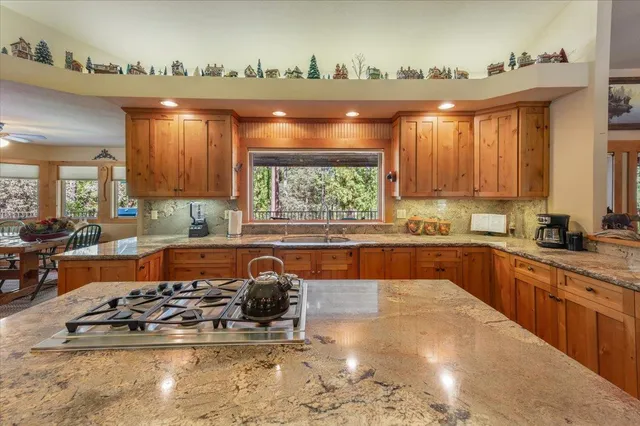 a bed sitting in a spacious bedroom next to a window