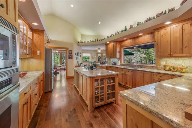 a bedroom with a bed and a flat tv screen on the dresser