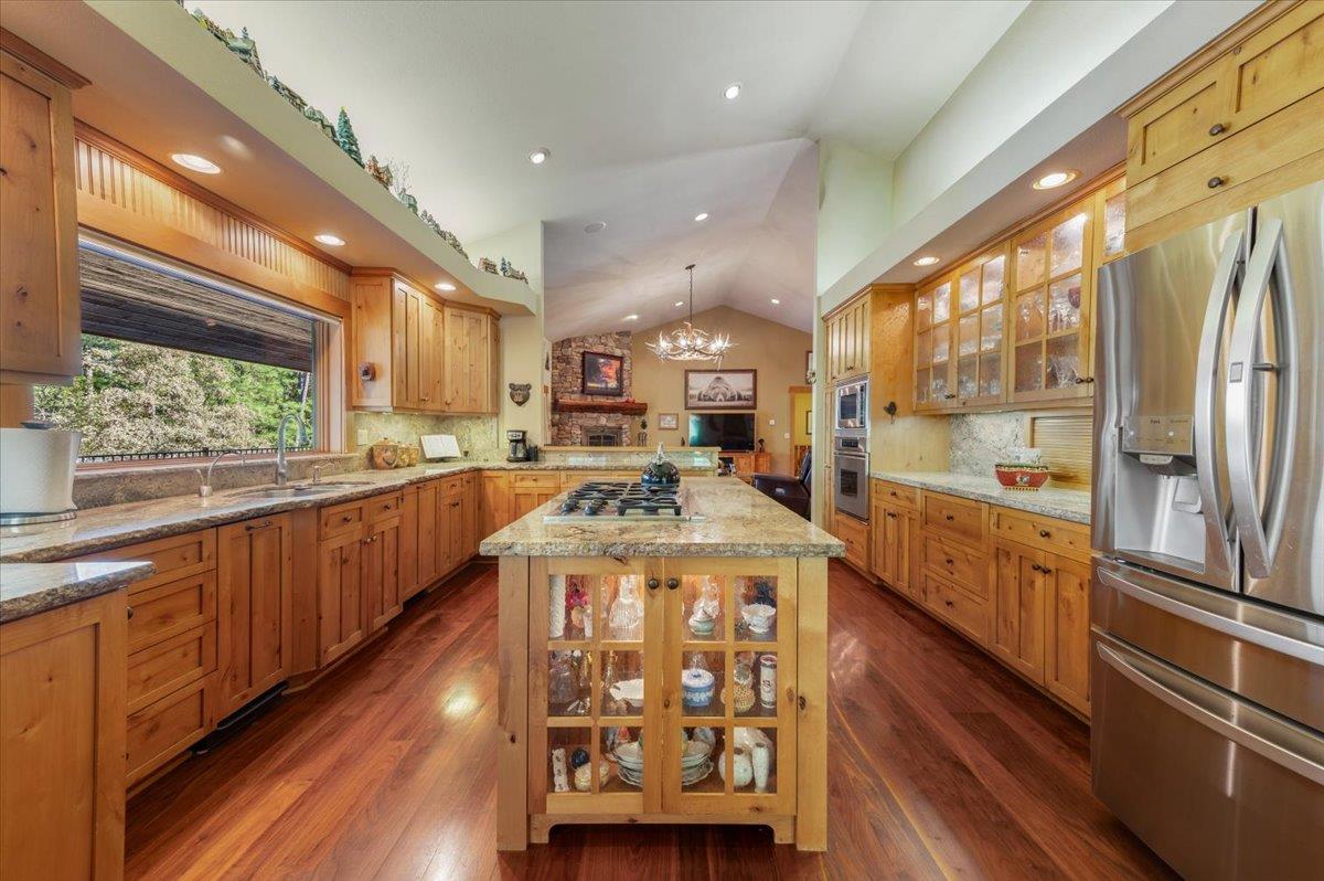 11790 Lowhills Road Nevada City, CA 95959 - Photo 20 of 68 a large kitchen with stainless steel appliances granite countertop a large counter top a stove and a wooden floors