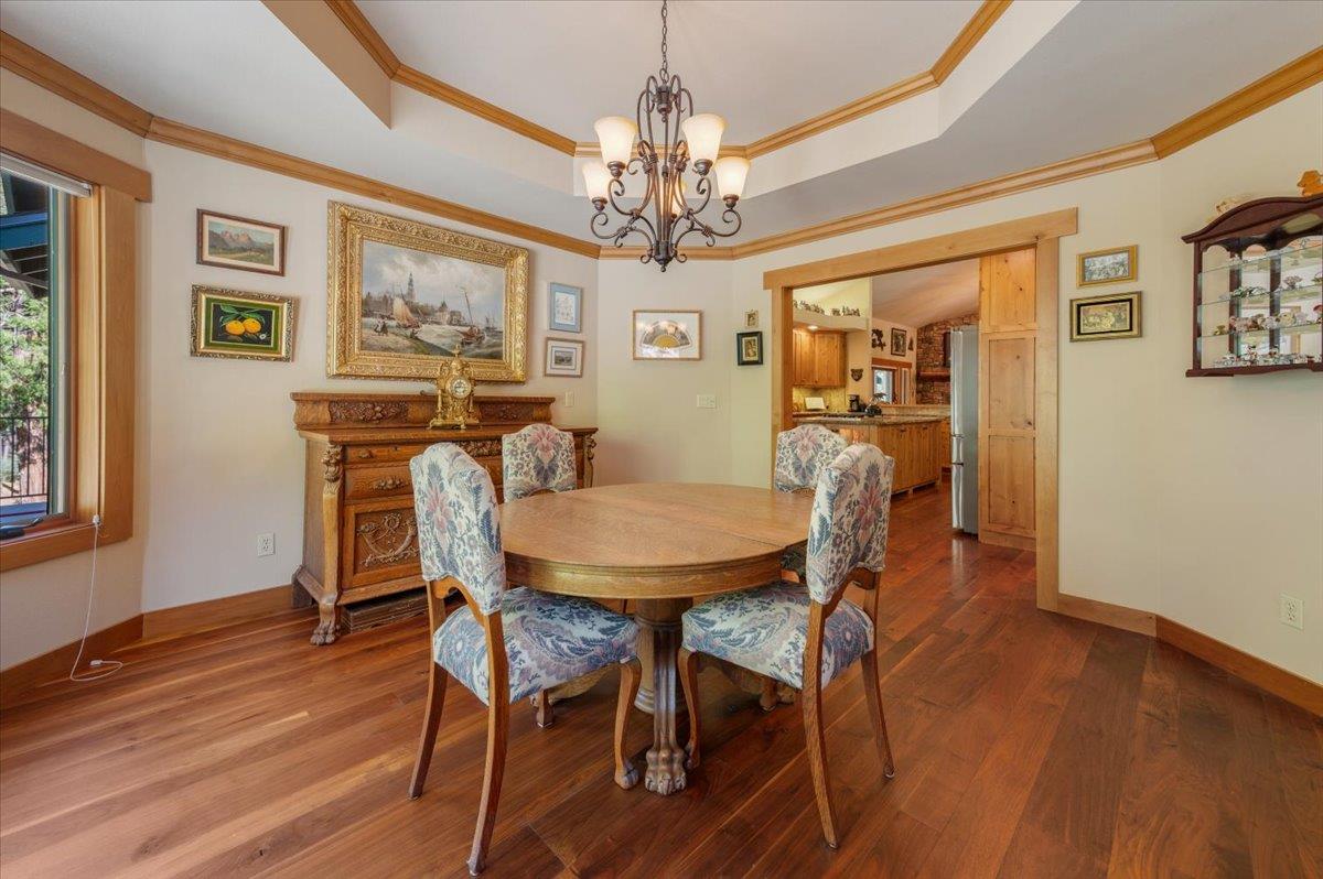 11790 Lowhills Road Nevada City, CA 95959 - Photo 21 of 68 a view of a dining room with furniture wooden floor and chandelier