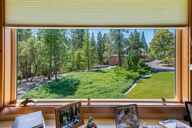 a utility room with stainless steel appliances granite countertop a stove and a refrigerator