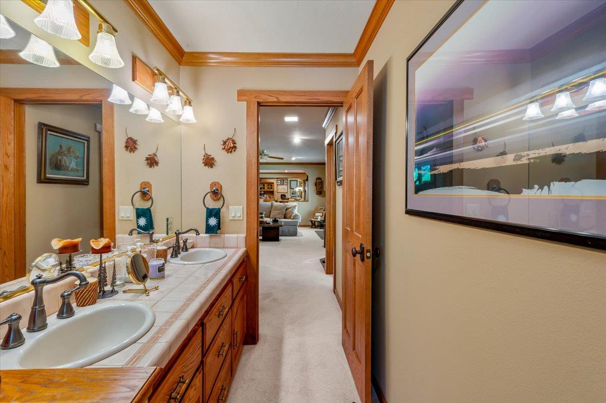11790 Lowhills Road Nevada City, CA 95959 - Photo 43 of 68 a en suite bathroom with a tub sink and mirror