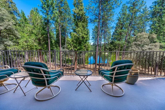 a bathroom with a sink a toilet and shower curtain