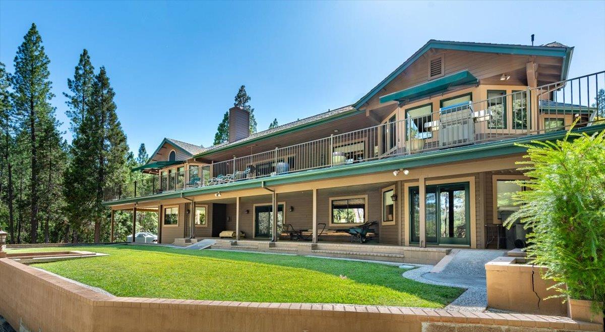 11790 Lowhills Road Nevada City, CA 95959 - Photo 5 of 68 a view of a white building with a swimming pool