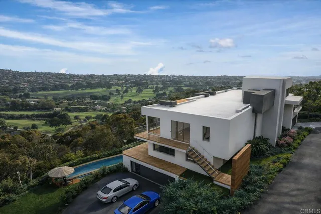 an aerial view of a house with a garden