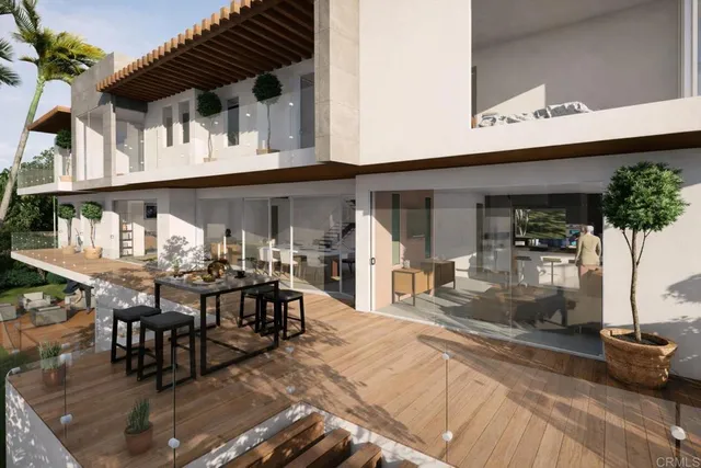 a view of a patio with table and chairs