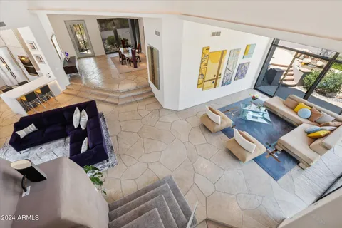a view of living room with furniture and rug