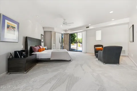 a bedroom with a bed and couch