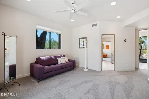 a living room with furniture and window