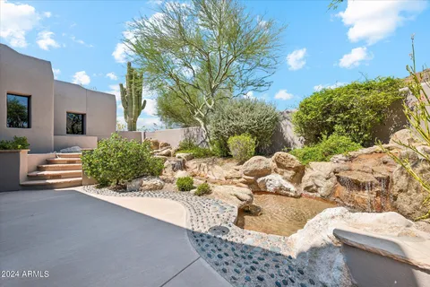 a view of backyard with outdoor seating