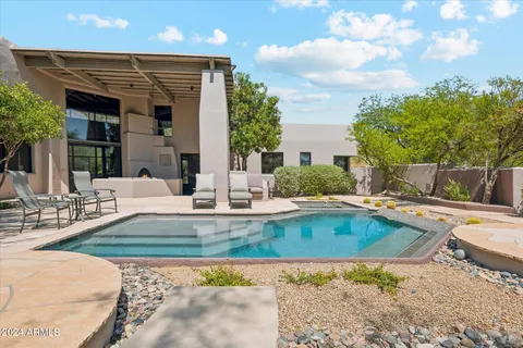 a view of a swimming pool with a patio
