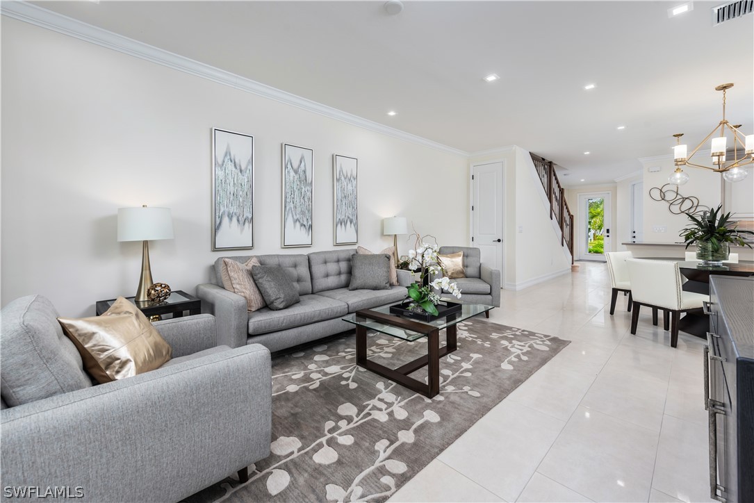 7341 Rockefeller Drive Naples, FL 34119 - Photo 11 of 34 a living room with furniture and wooden floor