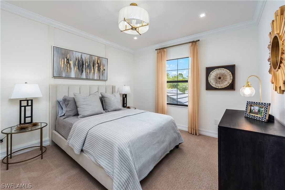 7341 Rockefeller Drive Naples, FL 34119 - Photo 22 of 34 a bedroom with a bed and a lamp on a dresser