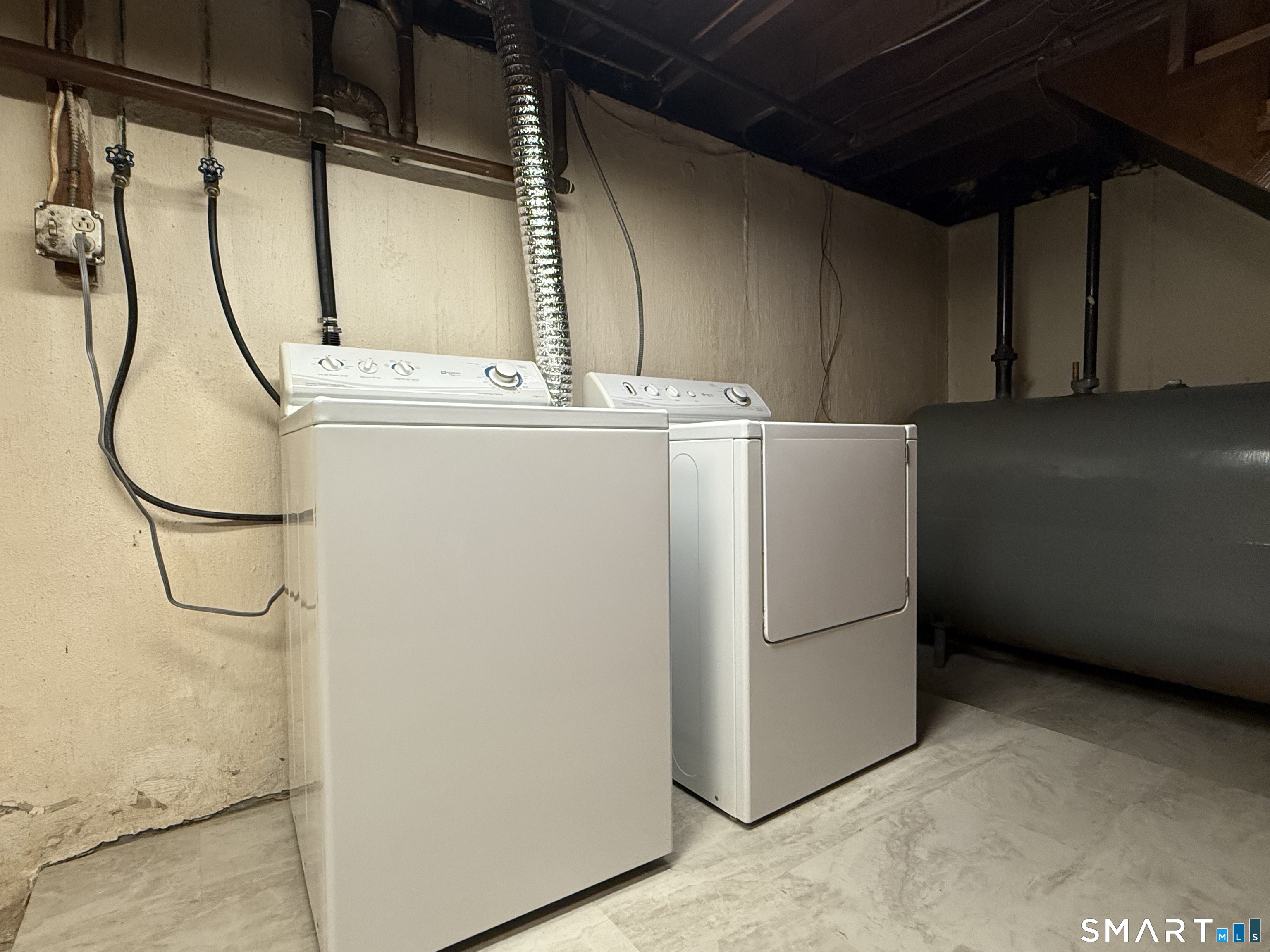 26 Maple Street Trumbull, CT 06611 - Photo 33 of 37 a utility room with dryer and washer