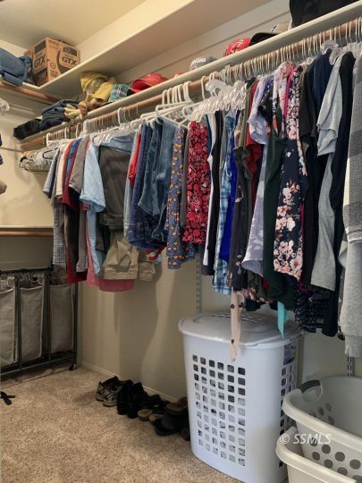 807 James Street Ridgecrest, CA 93555 - Photo 19 of 37 a view of walk in closet with clothes and shoes