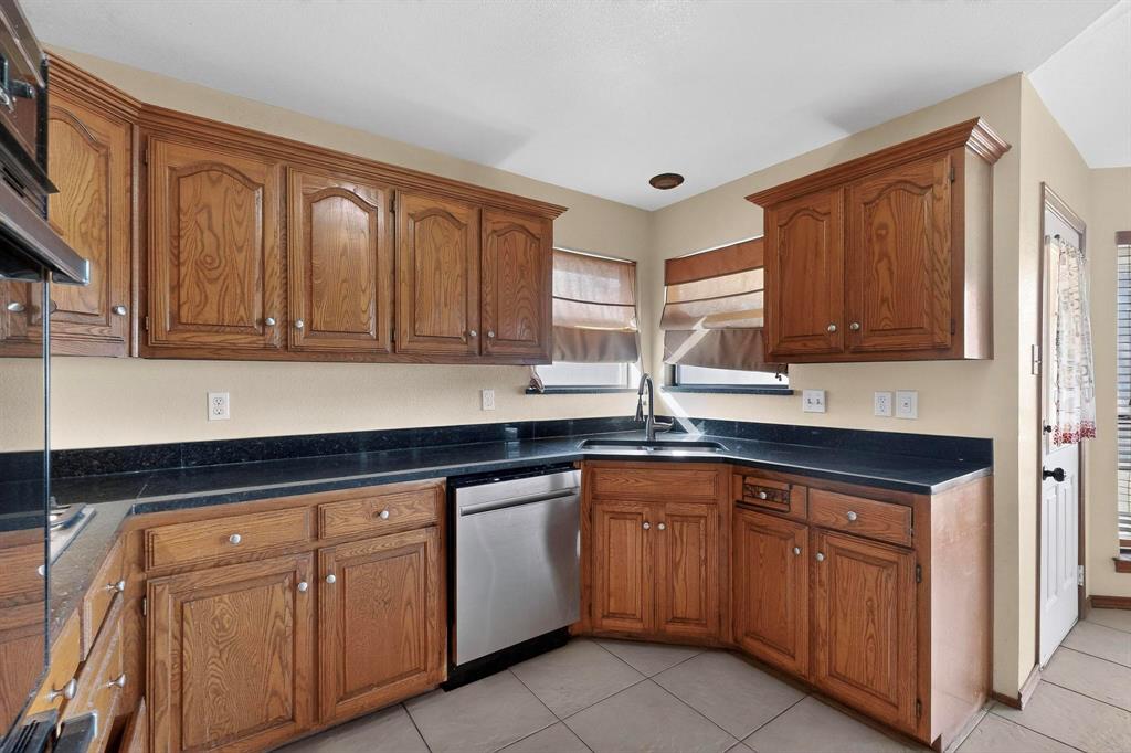 1121 Reedsport Place DeSoto, TX 75115 - Photo 11 of 40 a kitchen with sink and cabinets