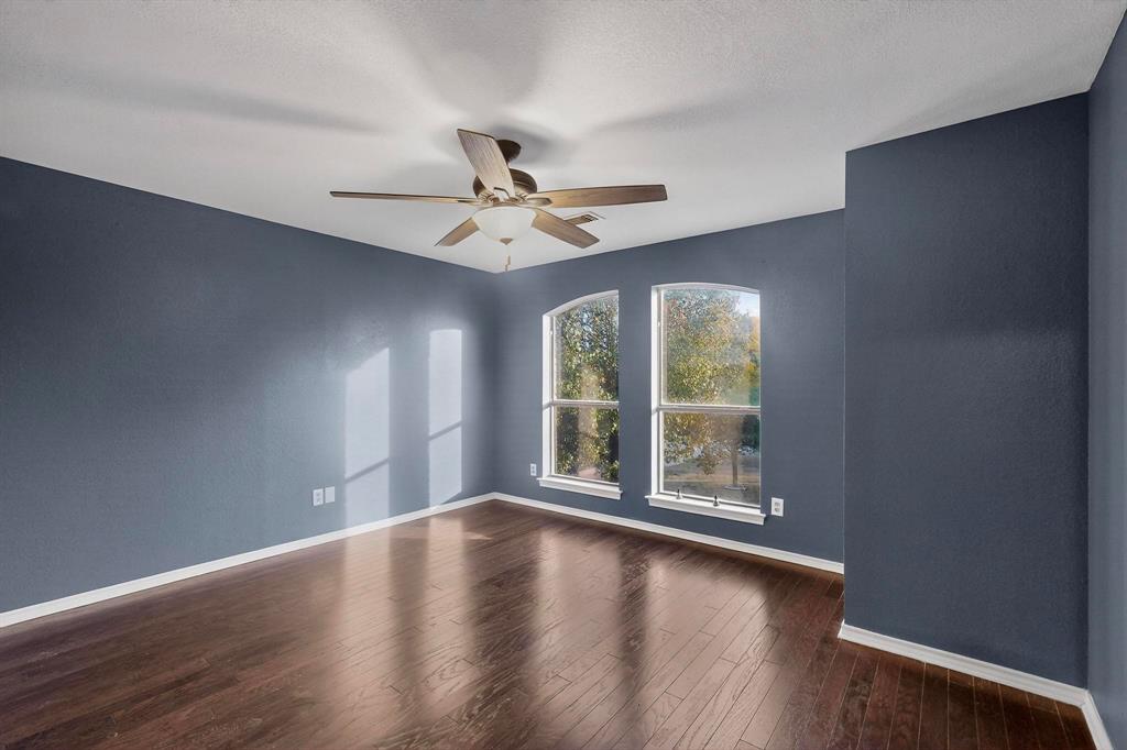 1121 Reedsport Place DeSoto, TX 75115 - Photo 23 of 40 a view of room with hardwood floor and ceiling fan