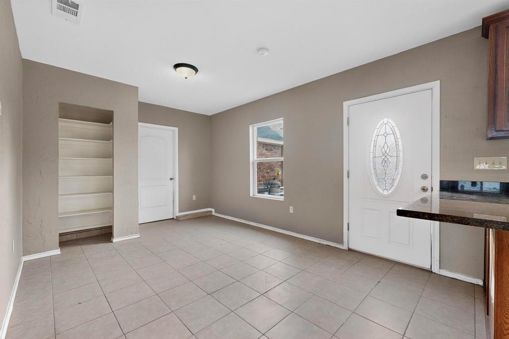 1121 Reedsport Place DeSoto, TX 75115 - Photo 32 of 40 a view of kitchen with cabinets and window