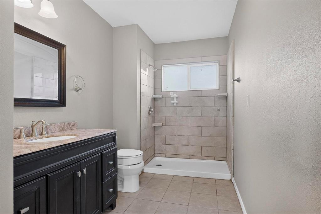 1121 Reedsport Place DeSoto, TX 75115 - Photo 35 of 40 a bathroom with a sink a toilet and shower