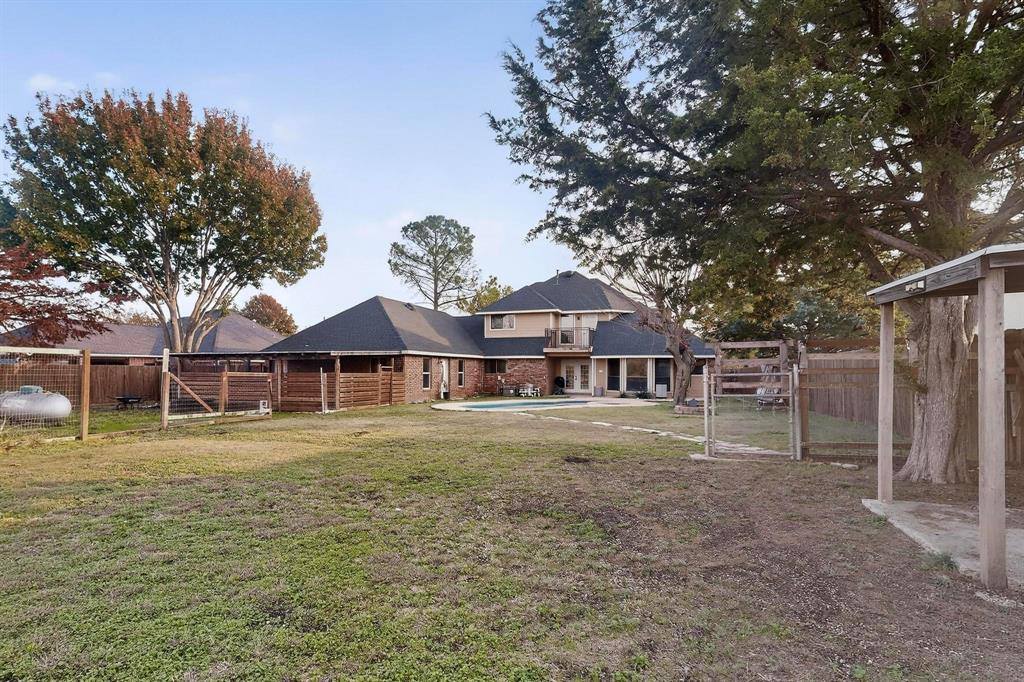 1121 Reedsport Place DeSoto, TX 75115 - Photo 37 of 40 a front view of a house with a garden