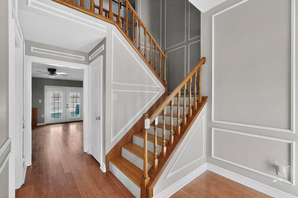 1121 Reedsport Place DeSoto, TX 75115 - Photo 5 of 40 a view of staircase with wooden floor and a rug