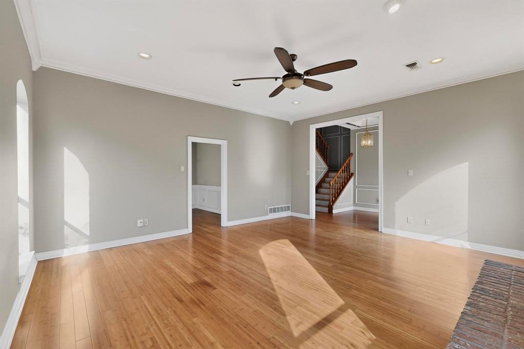 1121 Reedsport Place DeSoto, TX 75115 - Photo 7 of 40 a view of a livingroom with a ceiling fan and wooden floor