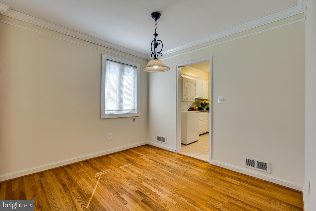 407 Royalton Road Silver Spring, MD 20901 - Photo 12 of 30 a view of a room with wooden floor closet and windows