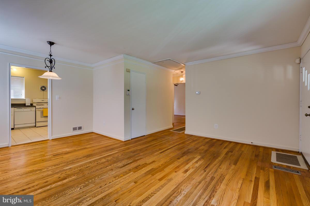 407 Royalton Road Silver Spring, MD 20901 - Photo 13 of 30 a view of empty room with wooden floor