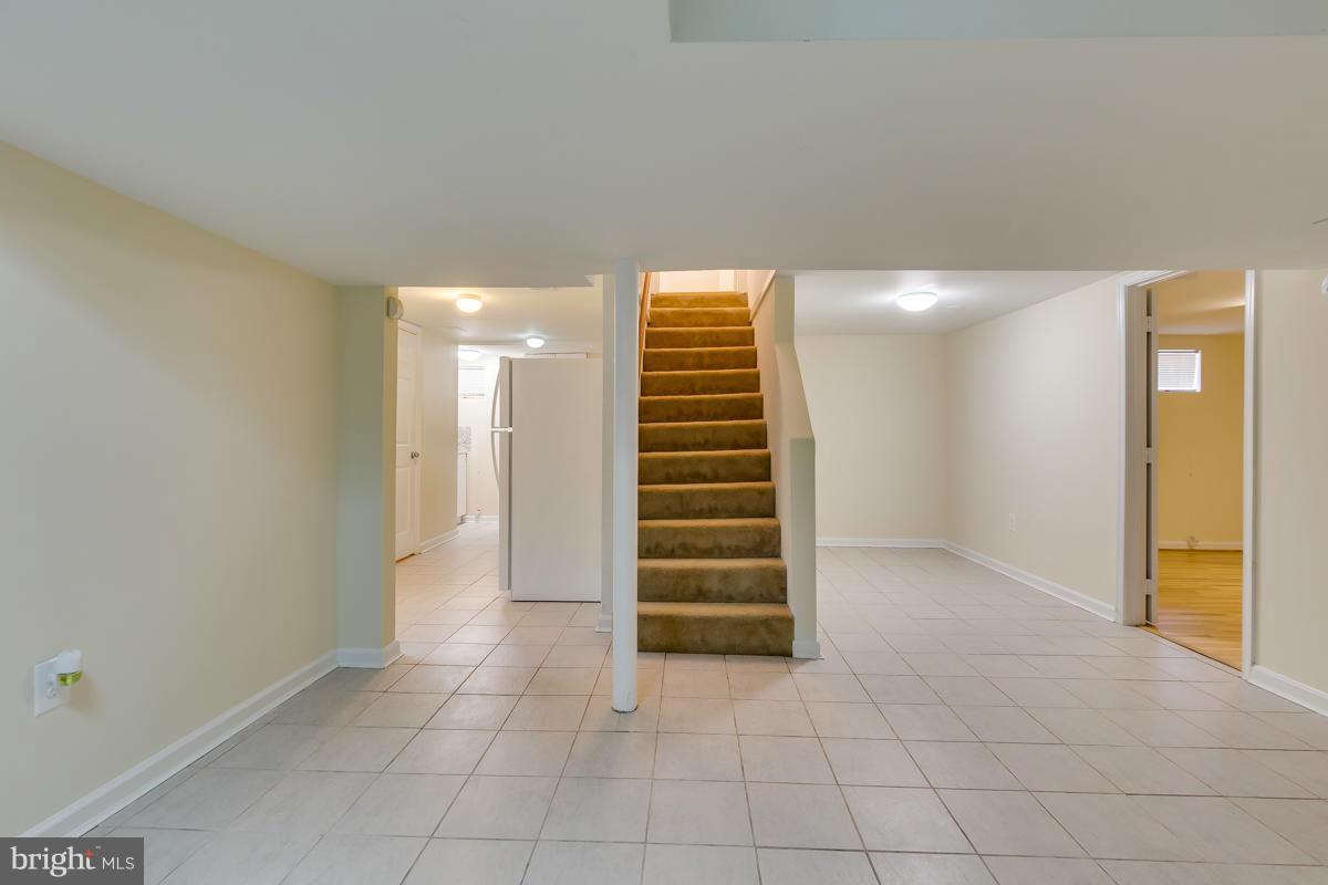407 Royalton Road Silver Spring, MD 20901 - Photo 3 of 30 a view of room with stairs and ventilation