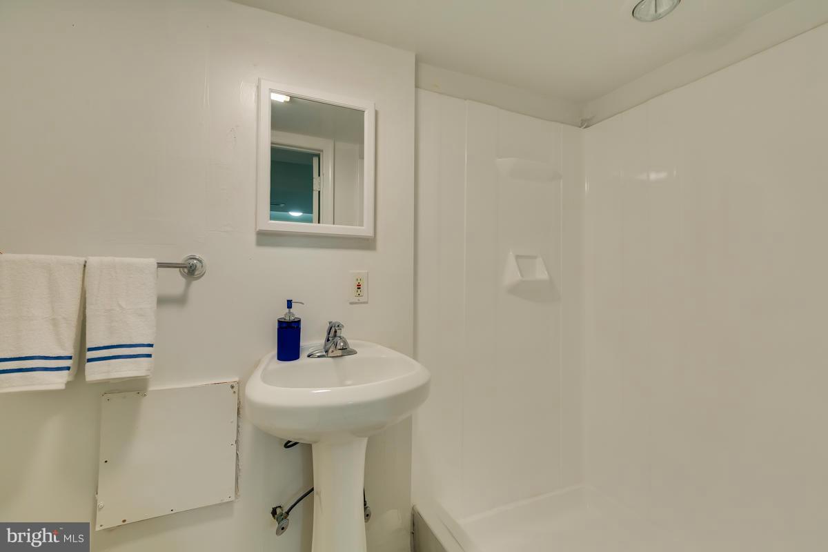 407 Royalton Road Silver Spring, MD 20901 - Photo 22 of 30 a bathroom with a sink and mirror
