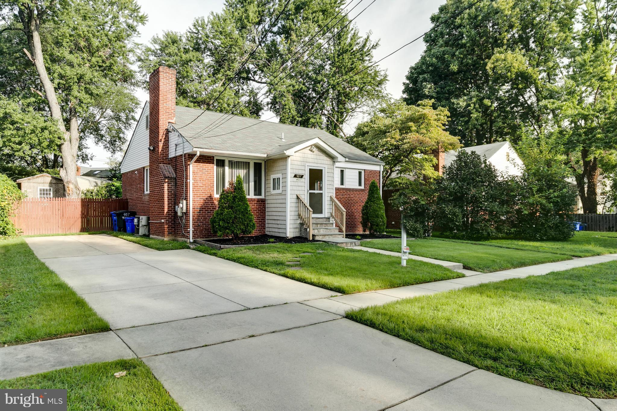 407 Royalton Road Silver Spring, MD 20901 - Photo 23 of 30 a view of a house with backyard and a tree
