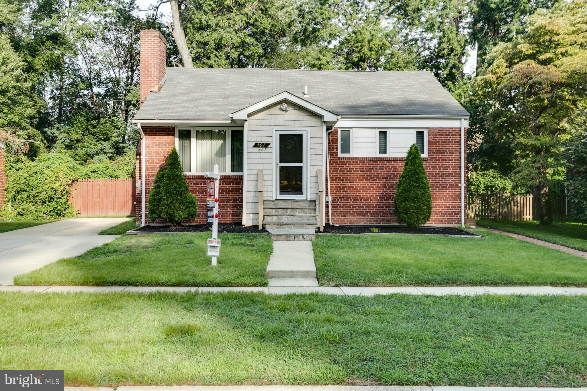 407 Royalton Road Silver Spring, MD 20901 - Photo 25 of 30 a front view of house with a garden and yard