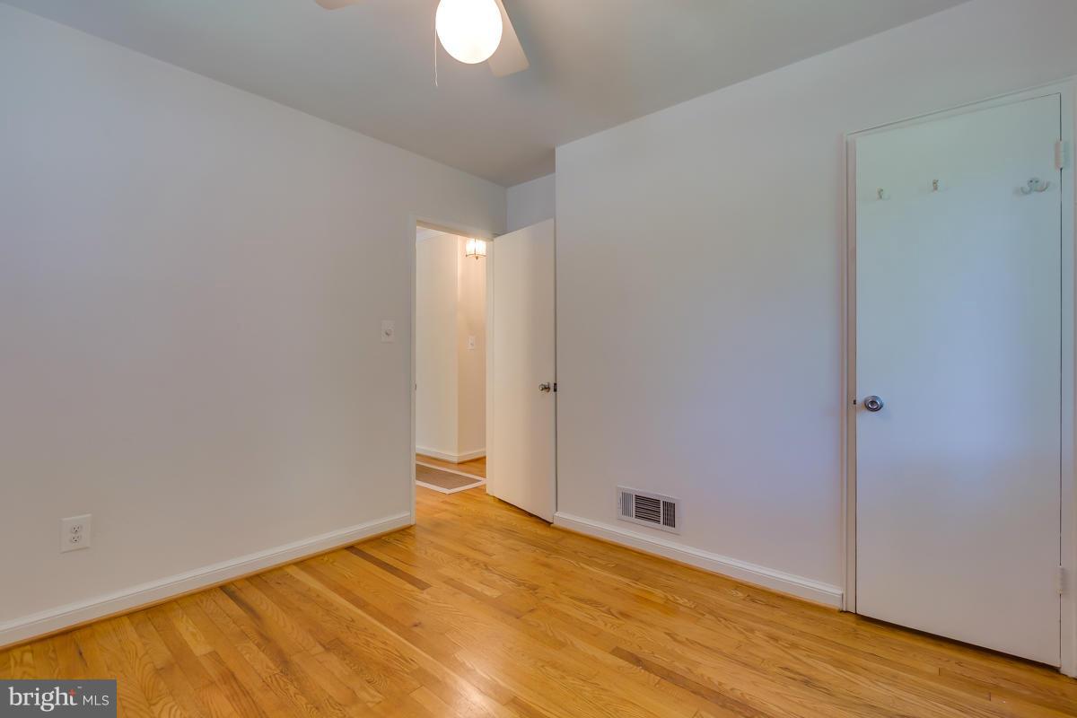 407 Royalton Road Silver Spring, MD 20901 - Photo 8 of 30 a view of empty room with wooden floor