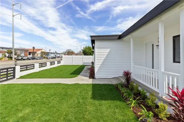 a view of a backyard with sitting area
