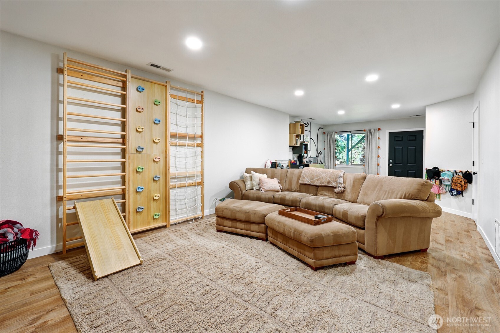 5126 South Garden Loop Road, Unit 11 Seattle, WA 98118 - Photo 23 of 36 a living room with furniture and a gate