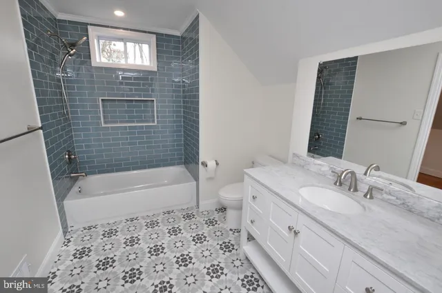 a bathroom with a bathtub sink and toilet