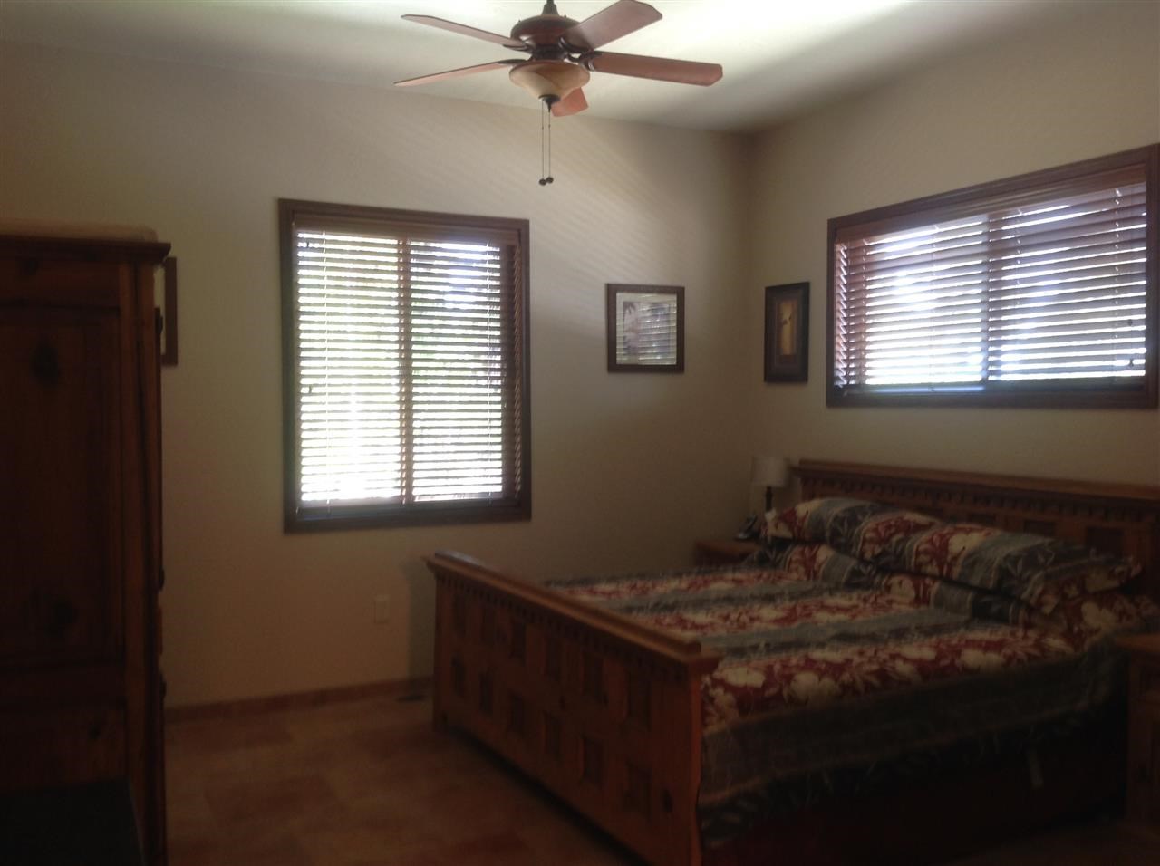 1092 South Hunters Run Show Low, AZ 85901 - Photo 11 of 36 a bedroom with a bed and a window