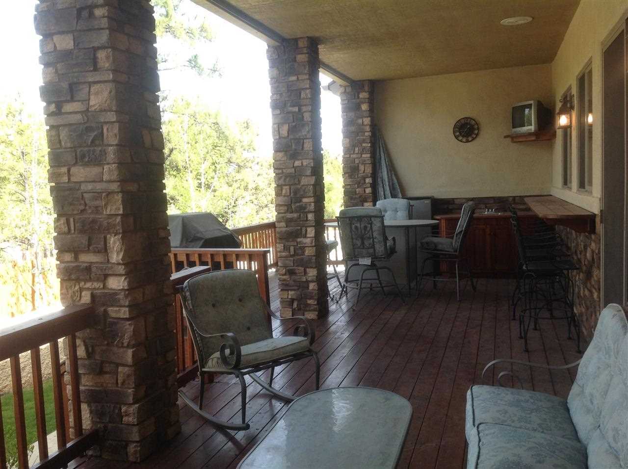 1092 South Hunters Run Show Low, AZ 85901 - Photo 12 of 36 a room with furniture and wooden floor