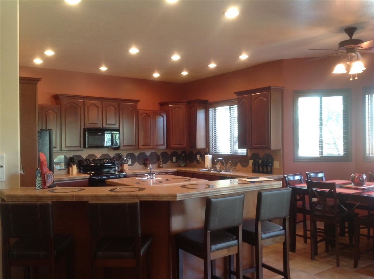 1092 South Hunters Run Show Low, AZ 85901 - Photo 14 of 36 a kitchen with sink and chairs