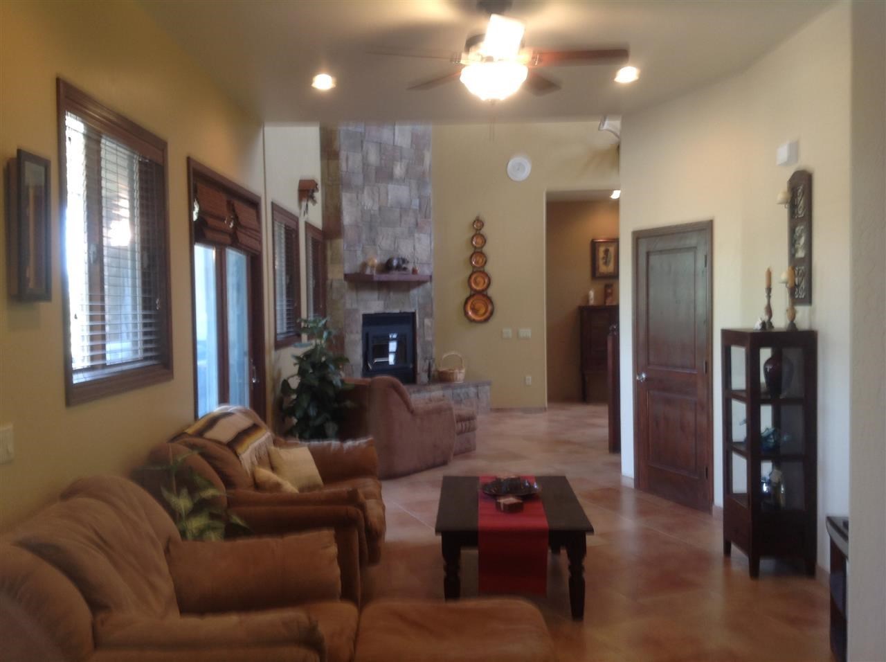 1092 South Hunters Run Show Low, AZ 85901 - Photo 18 of 36 a living room with furniture and a fireplace