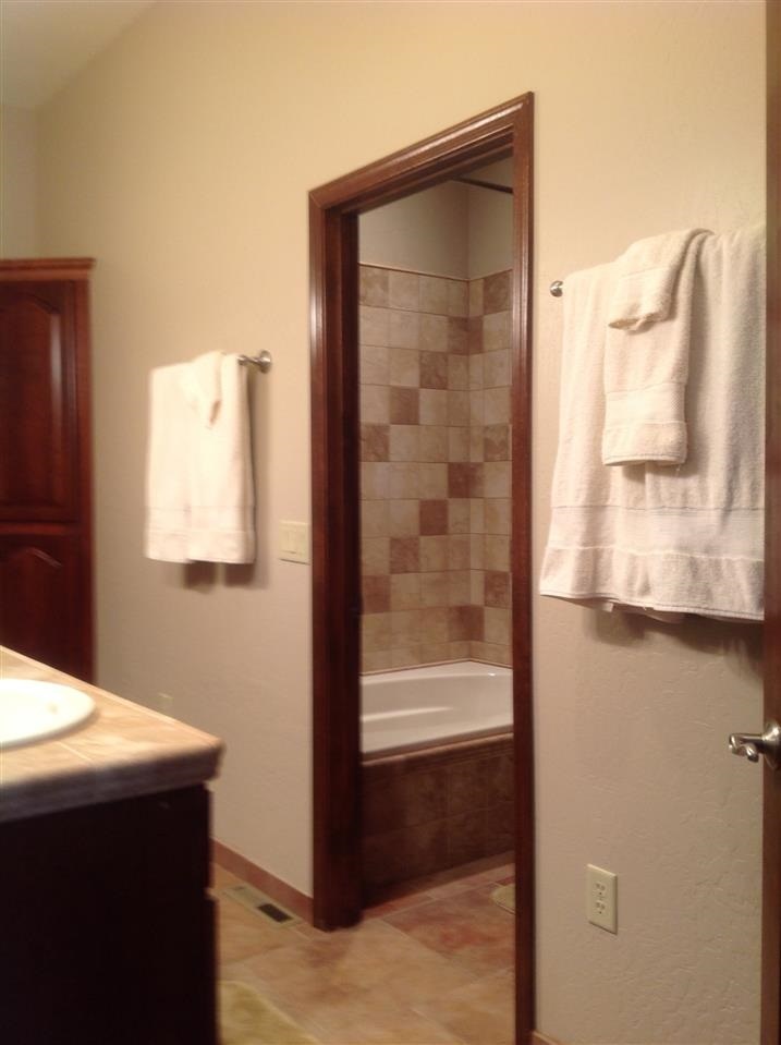 1092 South Hunters Run Show Low, AZ 85901 - Photo 35 of 36 a bathroom with a sink and a mirror