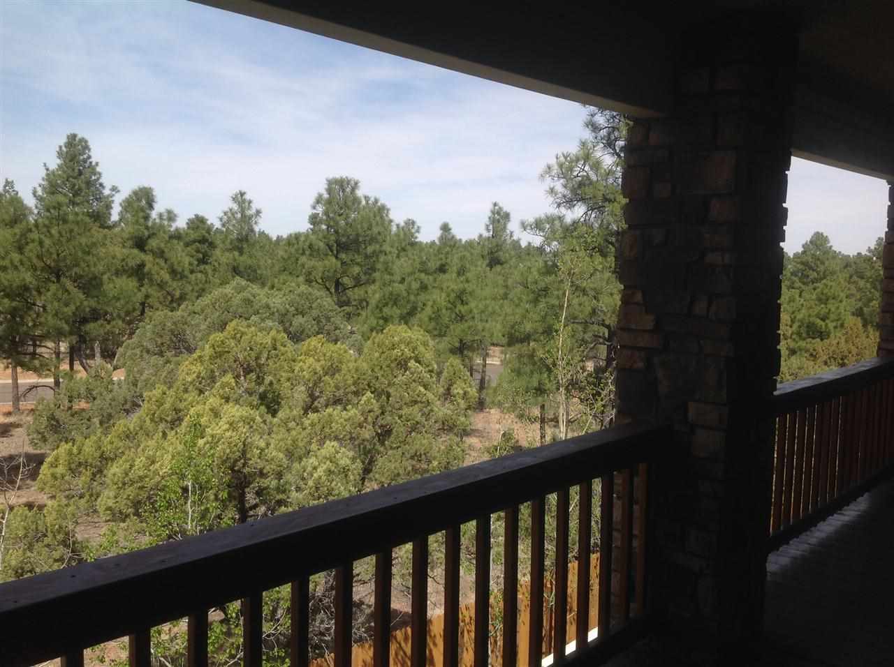 1092 South Hunters Run Show Low, AZ 85901 - Photo 4 of 36 a view of a balcony with wooden fence and floor