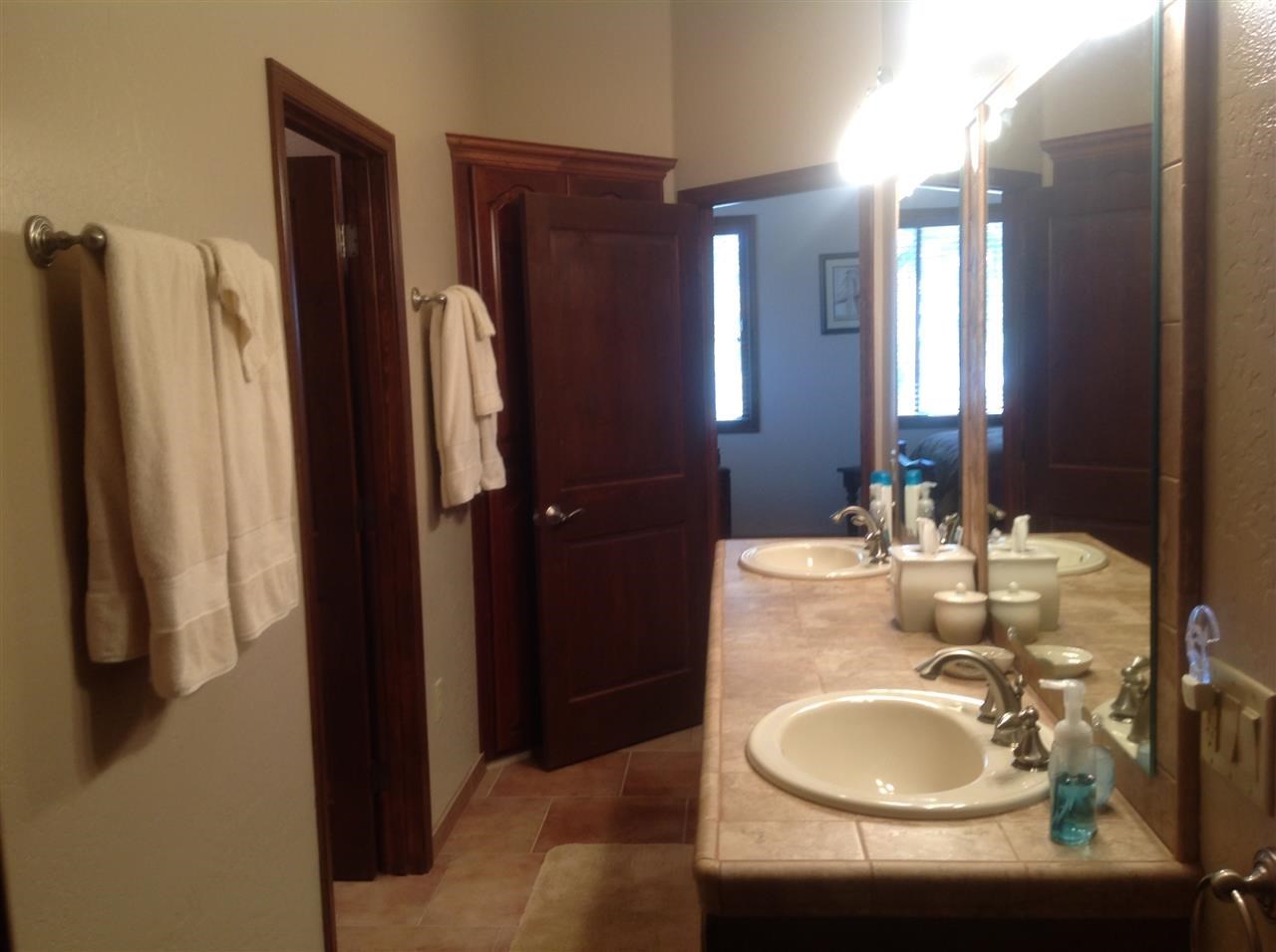 1092 South Hunters Run Show Low, AZ 85901 - Photo 7 of 36 a bathroom with a sink double vanity and a mirror