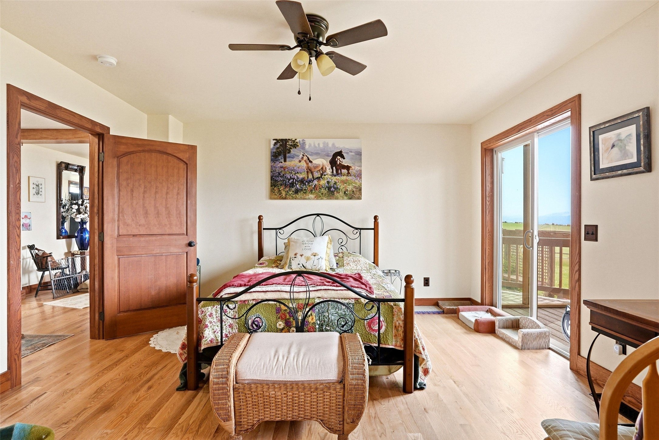 679 Hidden Valley Road North Florence, MT 59833 - Photo 34 of 85 Hardwood flooring throughout, with a ceiling fan overhead
