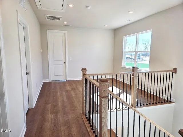 a view of entryway with wooden floor