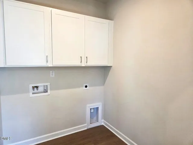 a view of cabinets and wooden floor